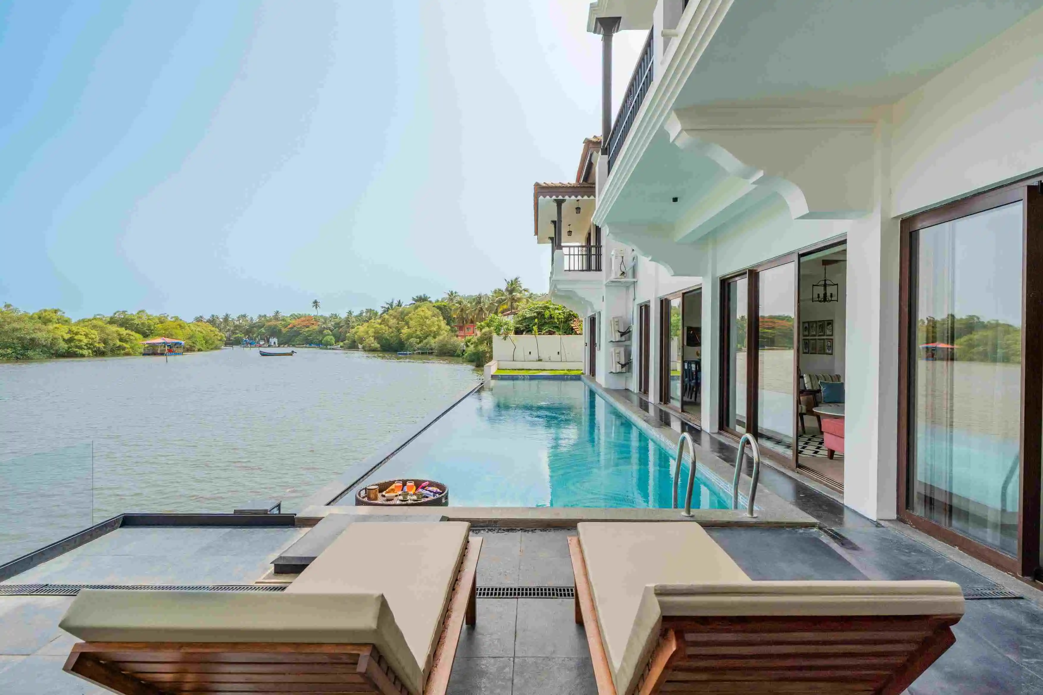 Villa Fleuve I 6-BHK Getaway By the River With Infinity Pool, Lift & Bar Lounge in Saipem near Candolim, North Goa
